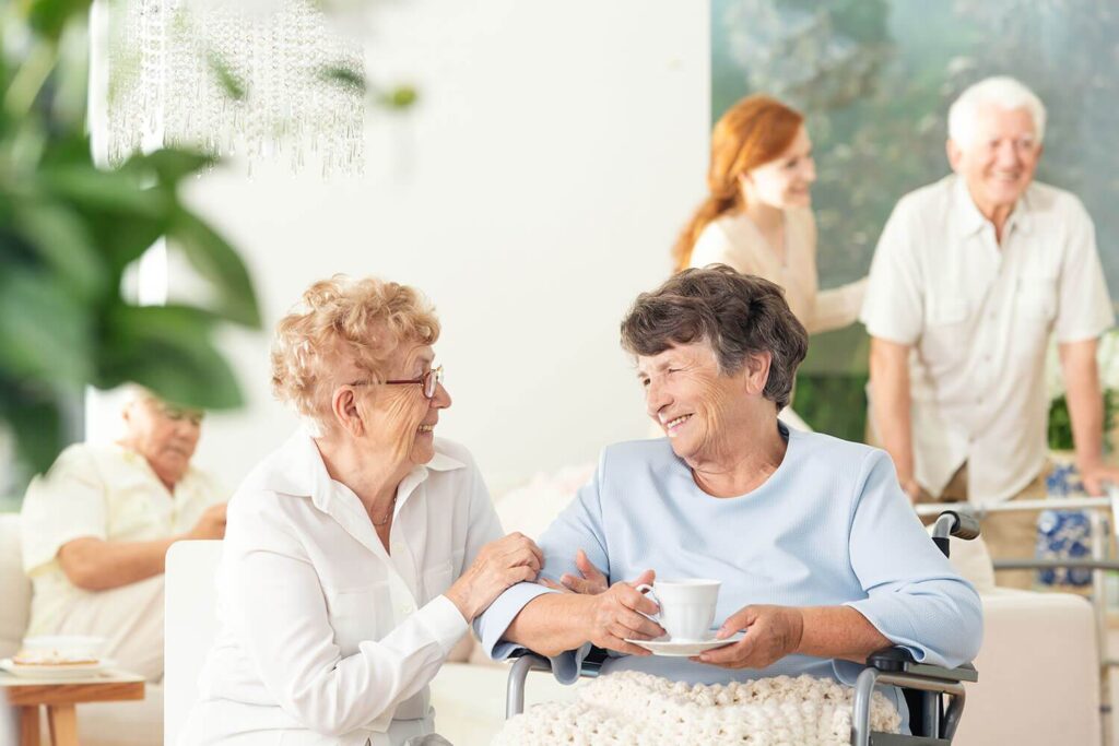 front-view-of-two-happy-geriatric-women-talking